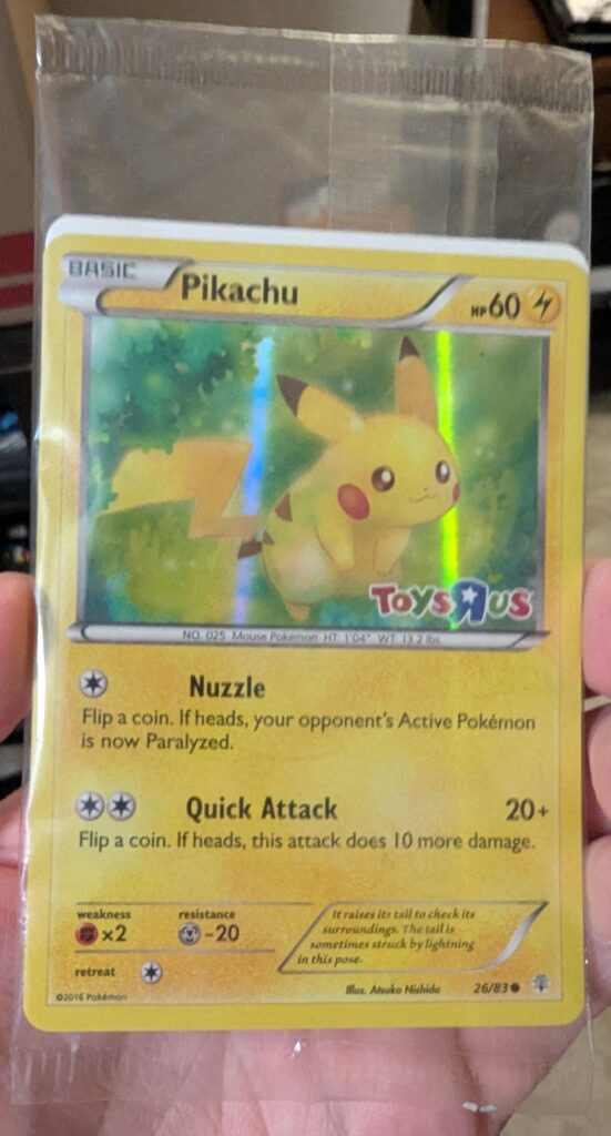 I have a plastic wrap sealed Toys R Us Pikachu from back in the day. Should I keep it wrapped or take out to be graded?