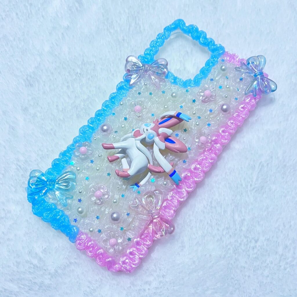 Sylveon and Mew phone cases I made using piped silicone!