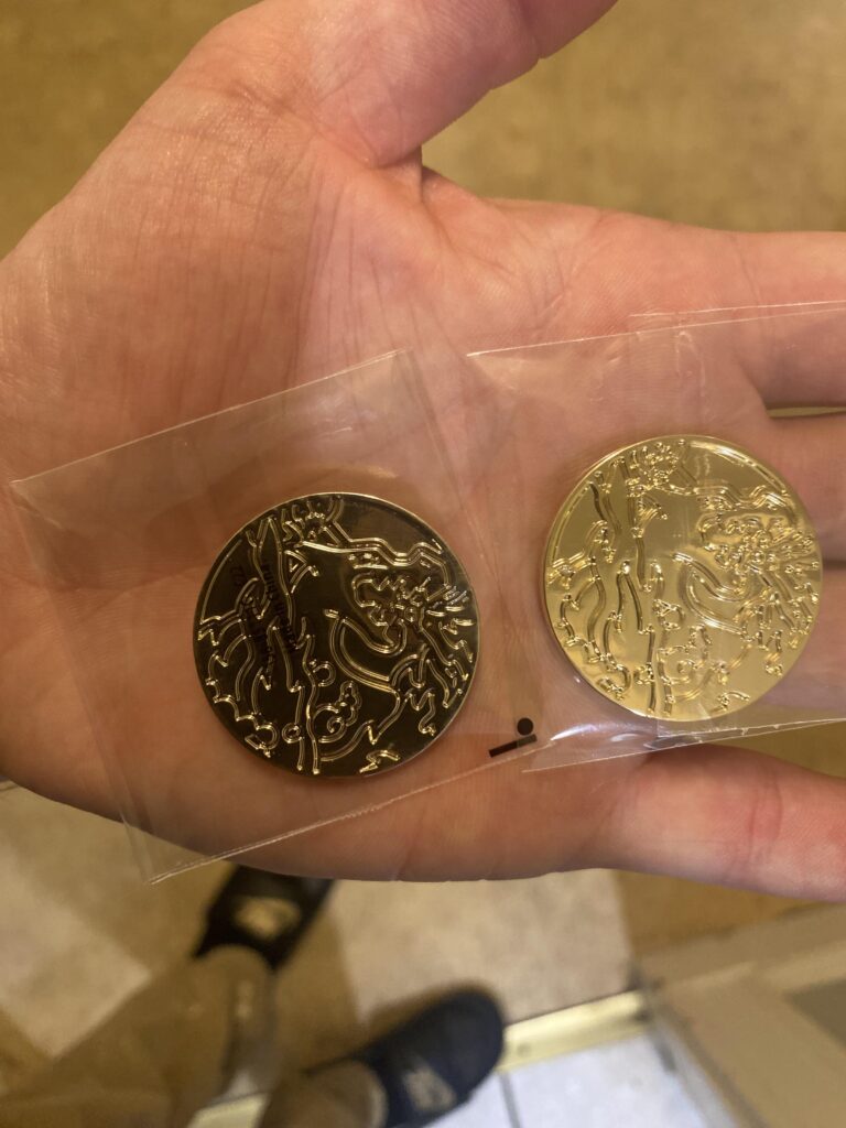 Silver Metal Charizard UPC Coin — Factory Error? Has Anyone Seen This Before?