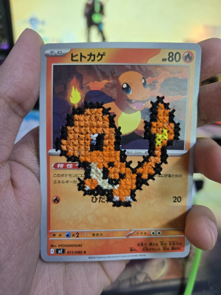 My wife made this cross stitch of Charmander