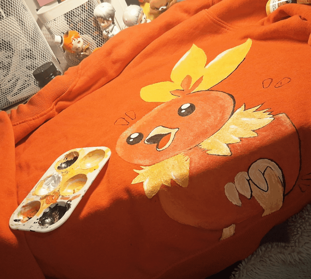 Painting Torchic onto a jumper