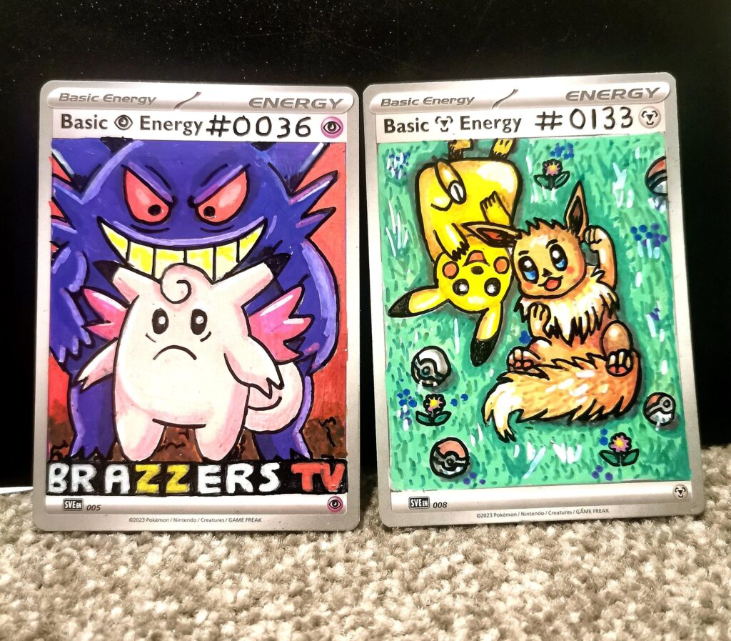 #036 & #133 completed for my one5one picture pokedex on (energy cards) after peaple saying gengar was looking sus had to add a cheecky lable to this dark card 😂 (oc)