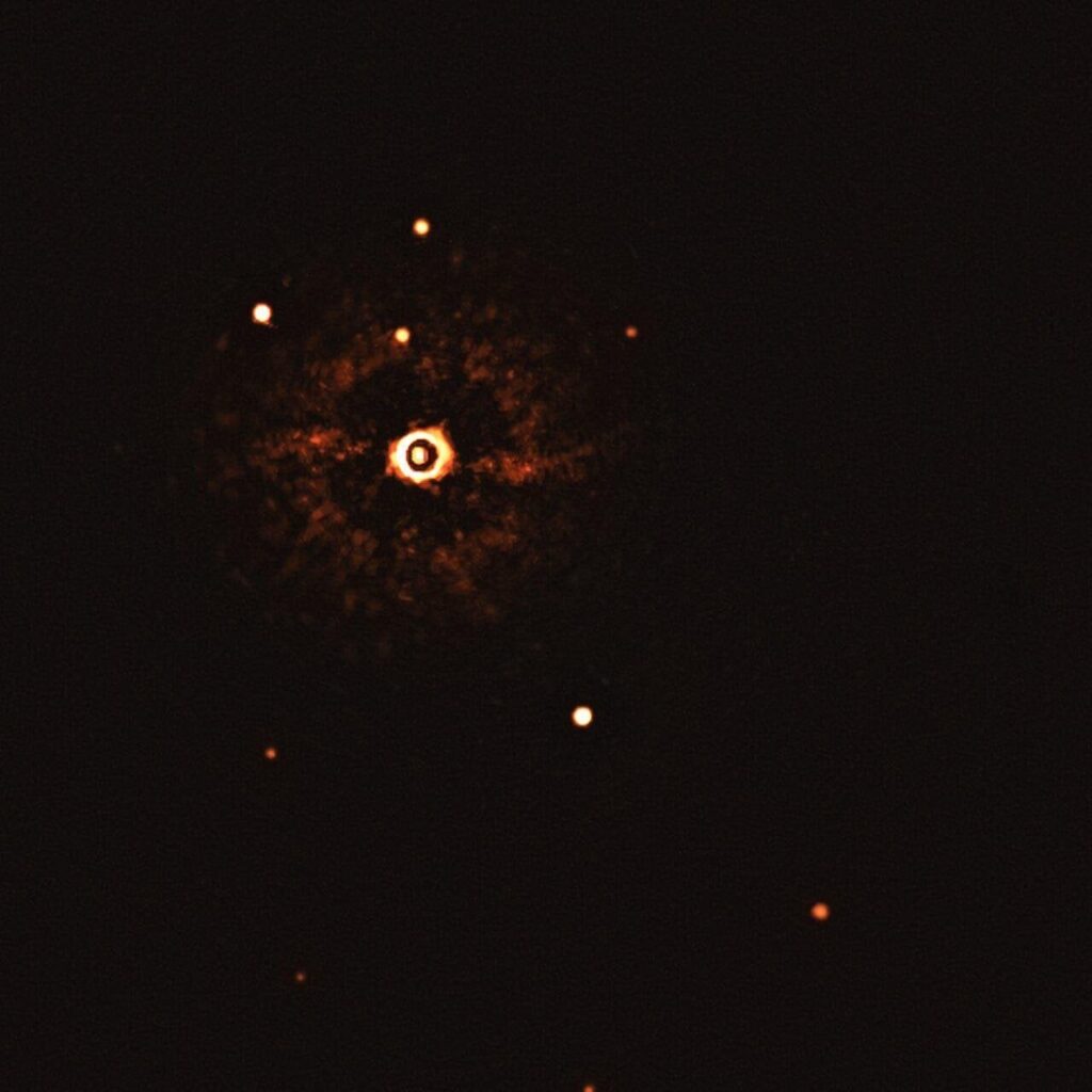 First Ever Image of a Multi-Planet System around a Sun-like Star looks like a pokeball.