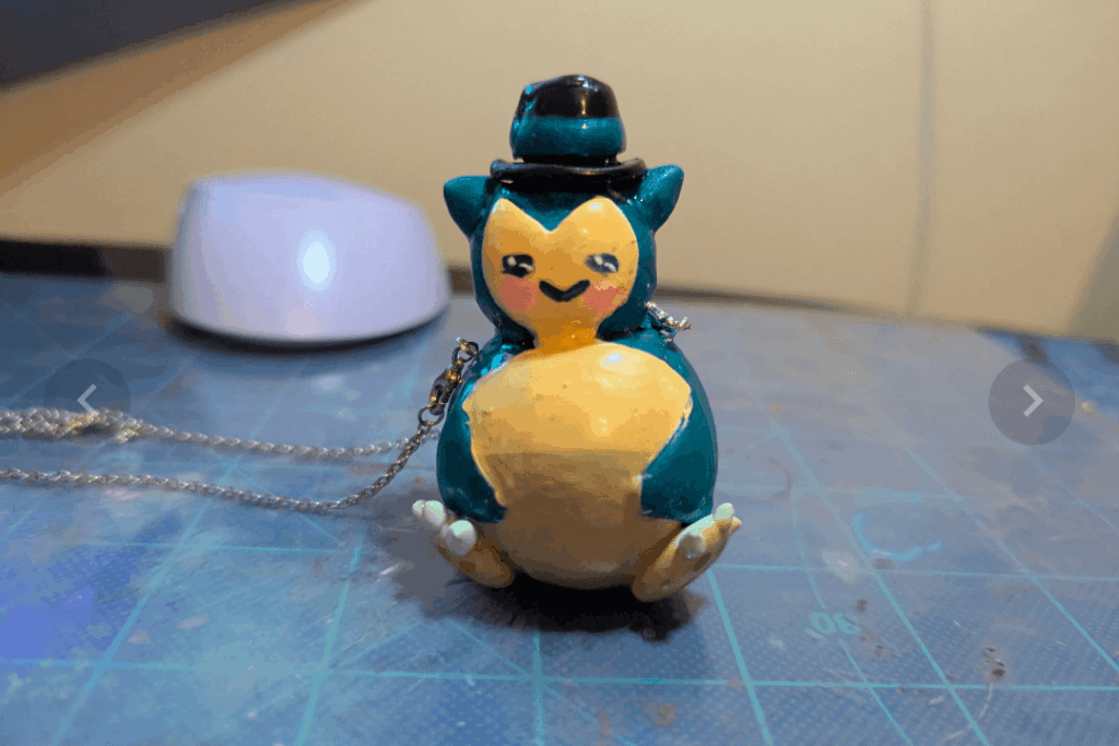 I remade my Snorlax in a top hat necklace commission. Which one do y'all like better? (first one was from April, second one was from tonight)