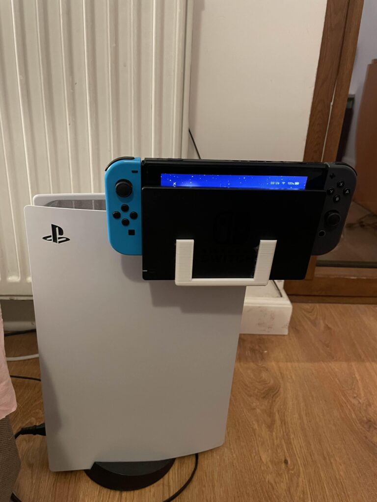 Made this 3d printed holder to attach nintendo switch console and dock to ps5