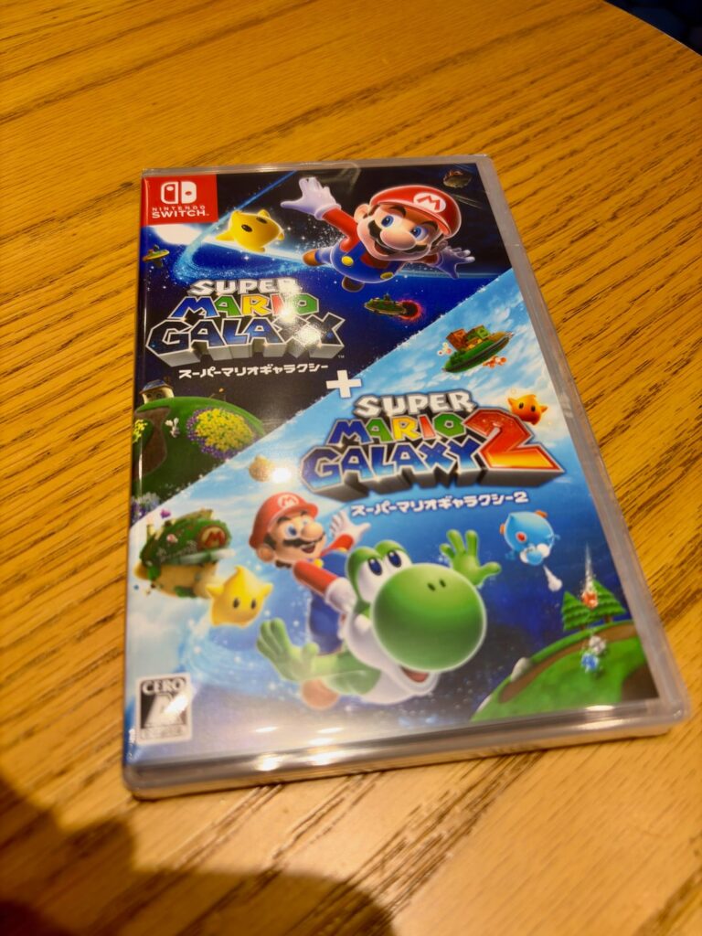 I went to the Nintento Tokyo store to pick the new Super Mario Galaxy and Super Mario Galaxy 2. Ended up picking up the book and some free goodies too.