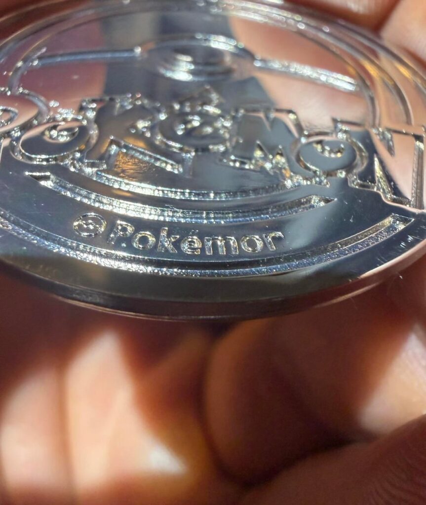 Did I just pull a 1-of-1 Charizard UPC error coin? It says POKEMOR