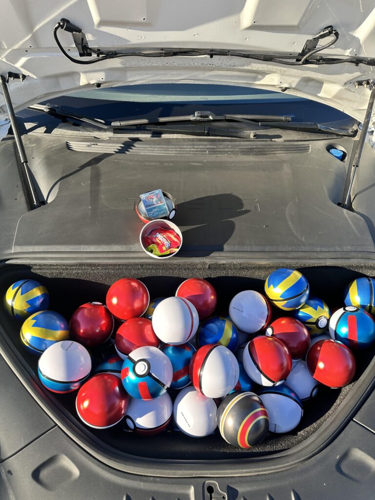 Bought a bunch of empty Pokeballs and Tins, filled them with candy and holo cards