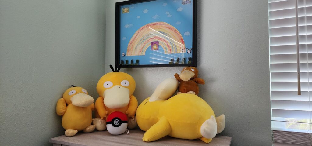 Psyduck shrine in my babies nursery