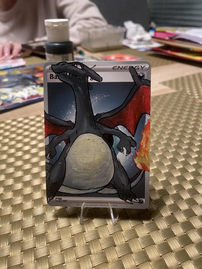 Wife was bored and painted an energy card that was laying around