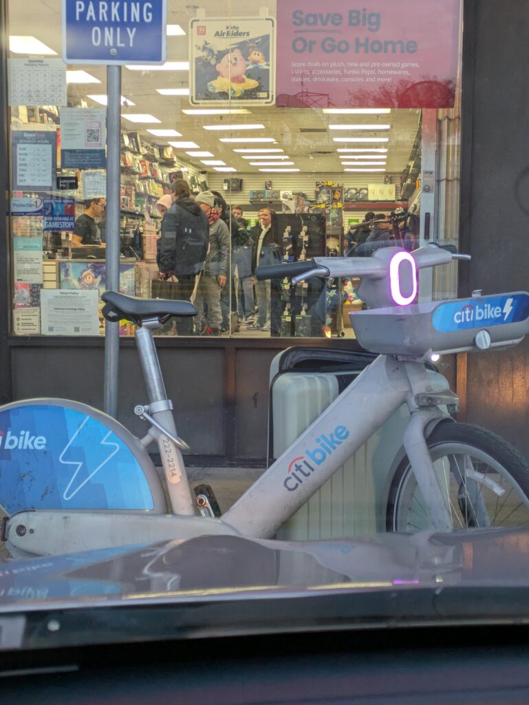 Scalper rolled up to GameStop on a Citi Bike with any empty Suitcase 😂