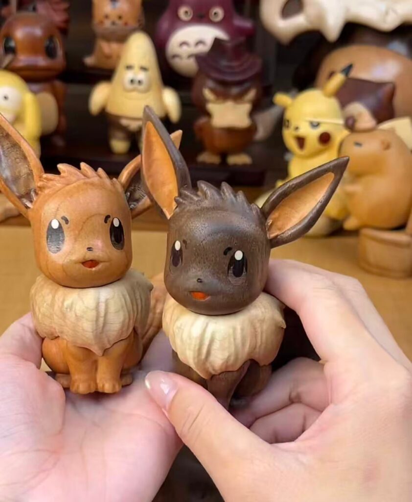 Just finished making these wooden Eevees from walnut and rosewood, which one do you prefer?