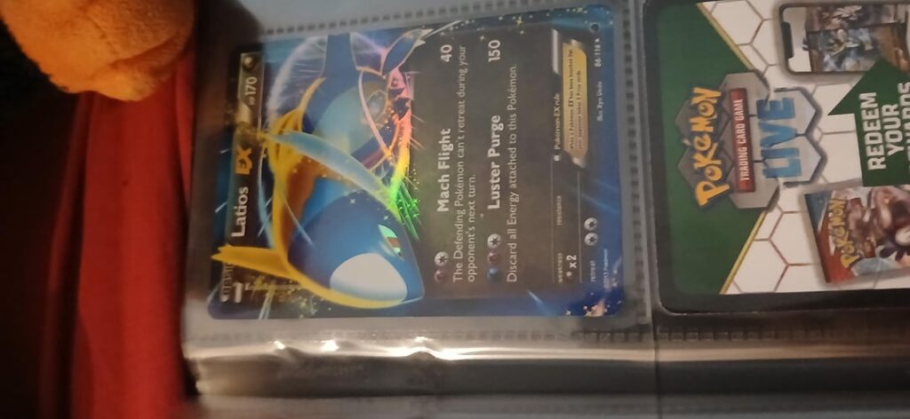 My lil sis just found back my 4 year old pokemon card book thought itd be fun to show it :D