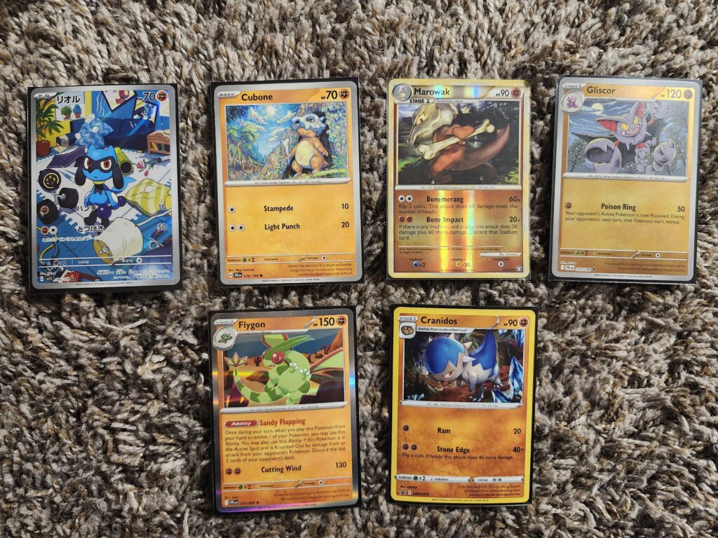 Some more card pickups! My favorite is the Riolu! 🤎