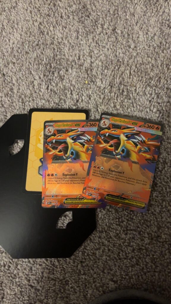My Tin came with 2 charizard promos