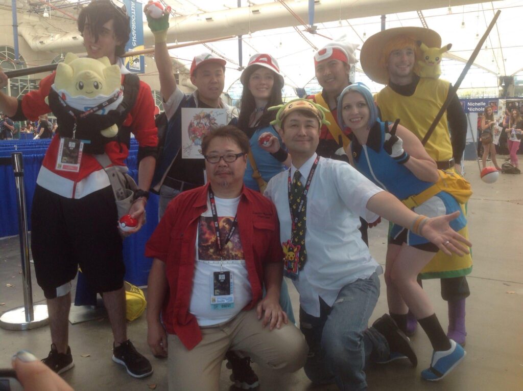 Pocket Monsters Special (Pokémon Adventures) manga creators Satoshi Yamamoto and Hidenori Kusaka with fans at San Diego Comic-Con 2016.