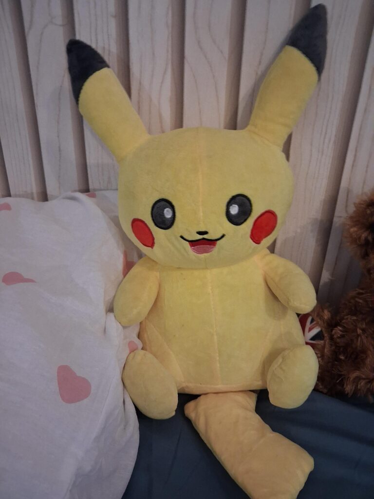 A cute Pikachu plushie I got while being on my Winter break! :3
