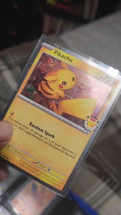 Pokemon Day Pikachu with a fat swirl (don't mind the shakes had trouble catching the holo)