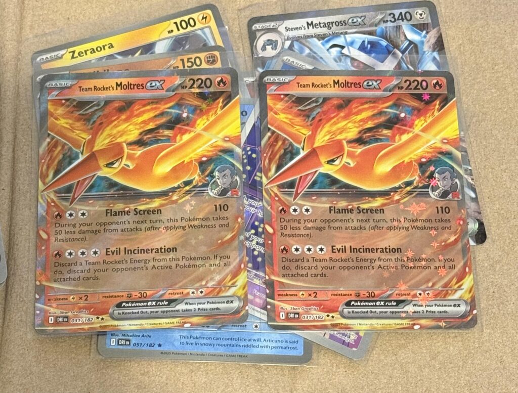 I just bought a handful of Destined Rivals and started opening them. Pulled both of these Moltres. Am I crazy or is the one on the right darker red/orange?