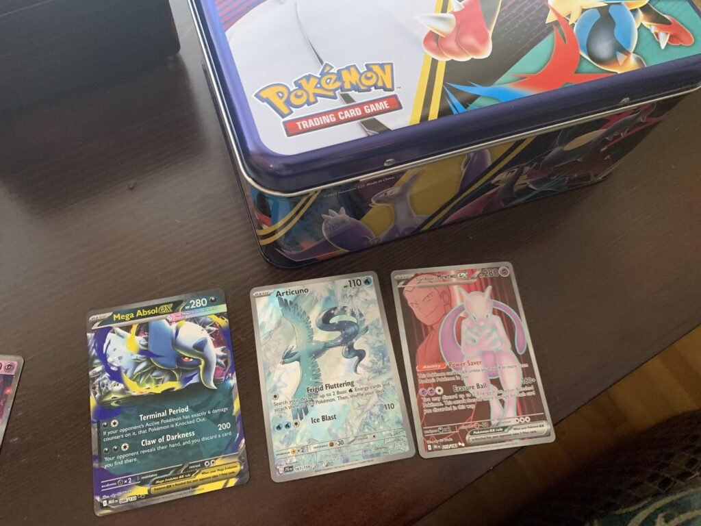 Pulls from the Pokémon Tin Treasure Chest found at Walmart