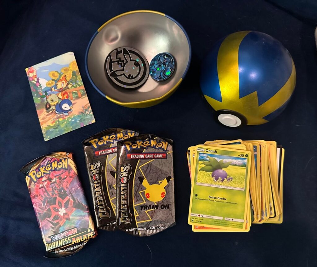 Was gifted this quick ball tin years before I started collecting Pokemon cards, reopened it this week and found all these goodies from the 25th anniversary!!