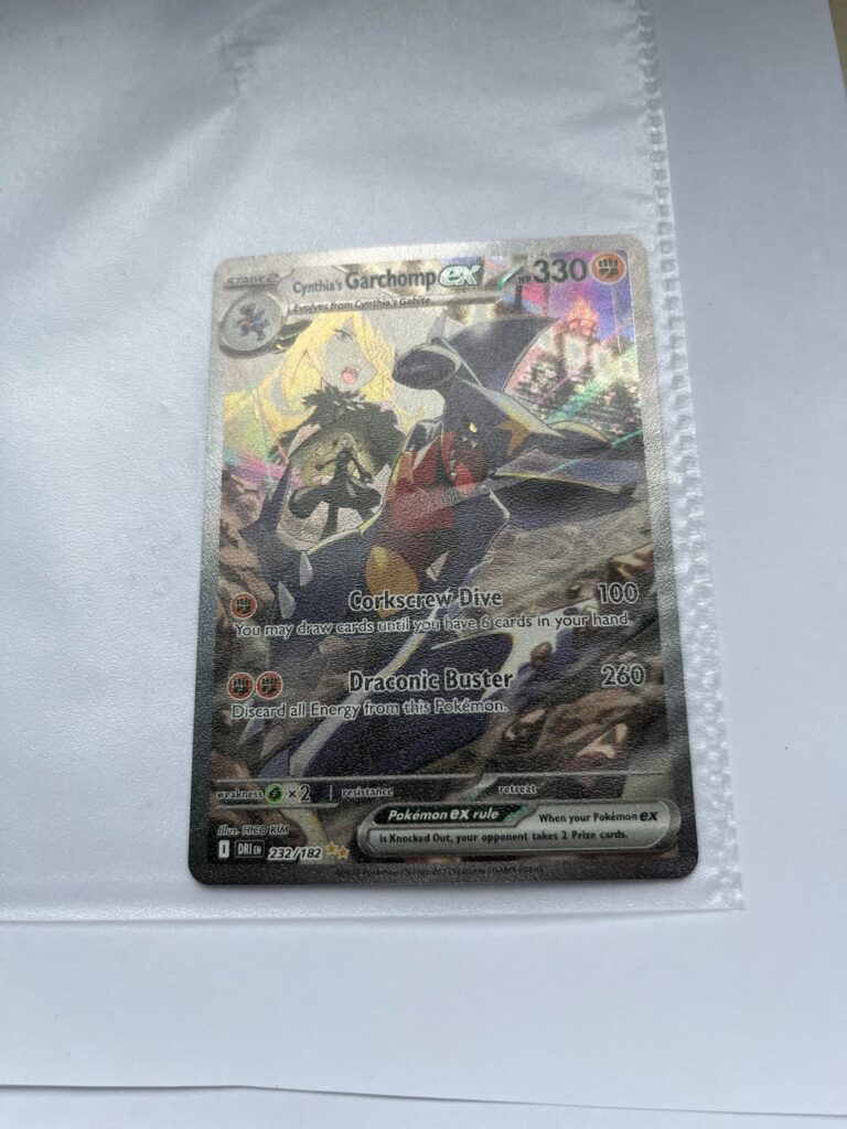 Cynthia’s Garchomp ex SIR (232/182) – factory crimped edge