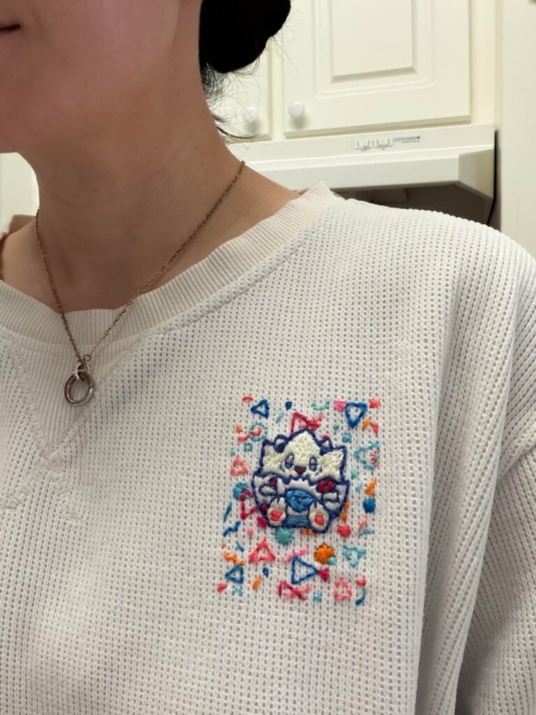 I embroidered my favorite Pokémon card on my favorite sweater
