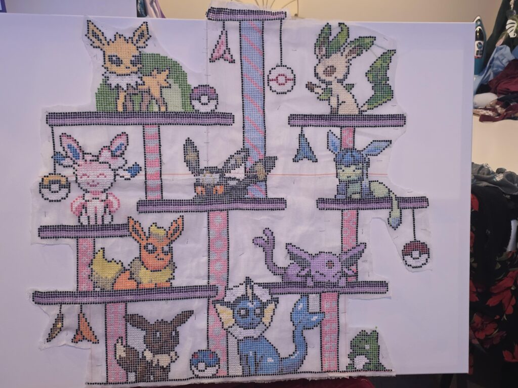 After about 2 months i've finally finished this cross stitch pattern i've been working on of eevee evolutions on a cat tree 😁