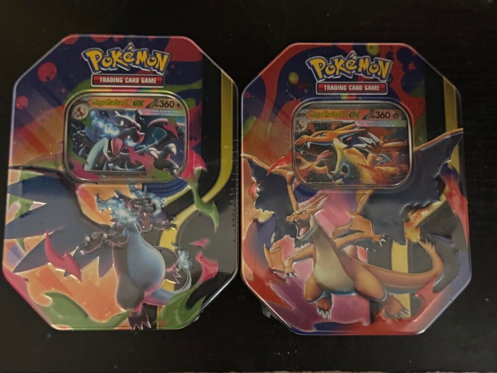 2 Mega Charizard Tins with pulls