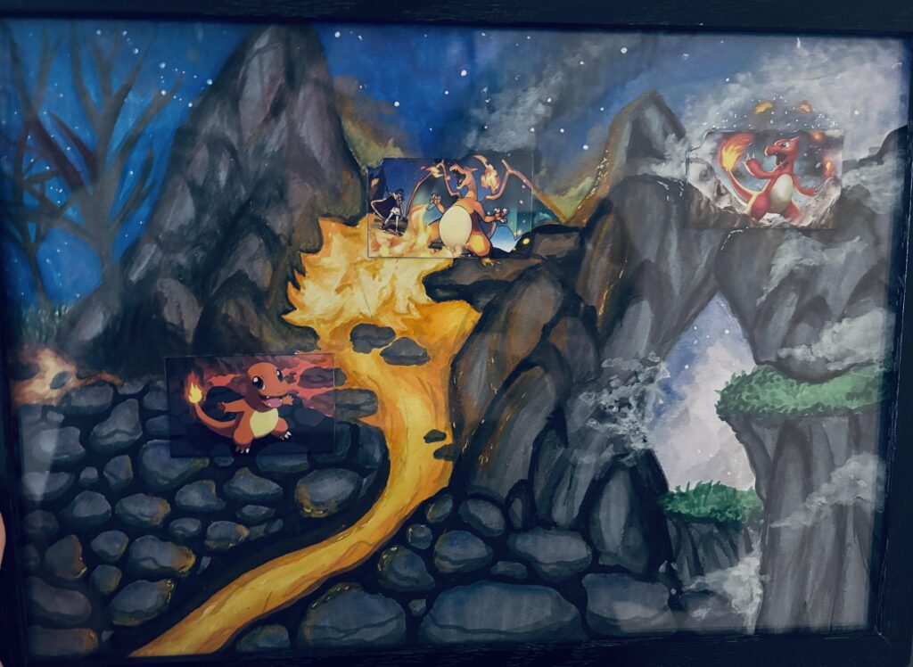 I gave my niece the Charizard evolution line as TCGs, and she created this masterpiece for me.