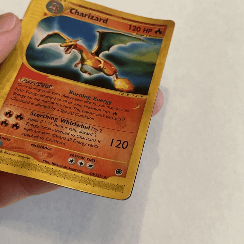 On the back of this card is another rare Charizard card that is glued and attached to it.