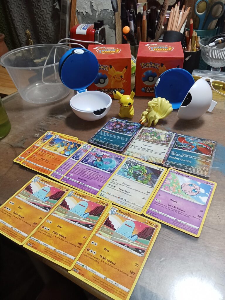 Pokemon card from mcdo happy meal and pikachu, ninetales evolution suprise from jollibee kids meal.