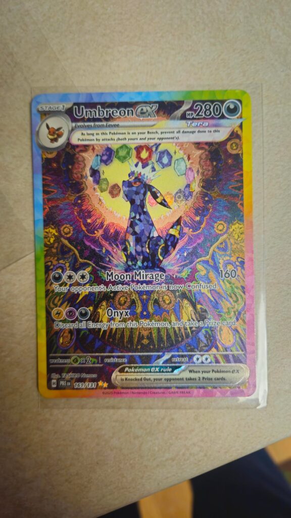 Traded for a Prismatic Umbreon and didn't realize it has a finger print dent