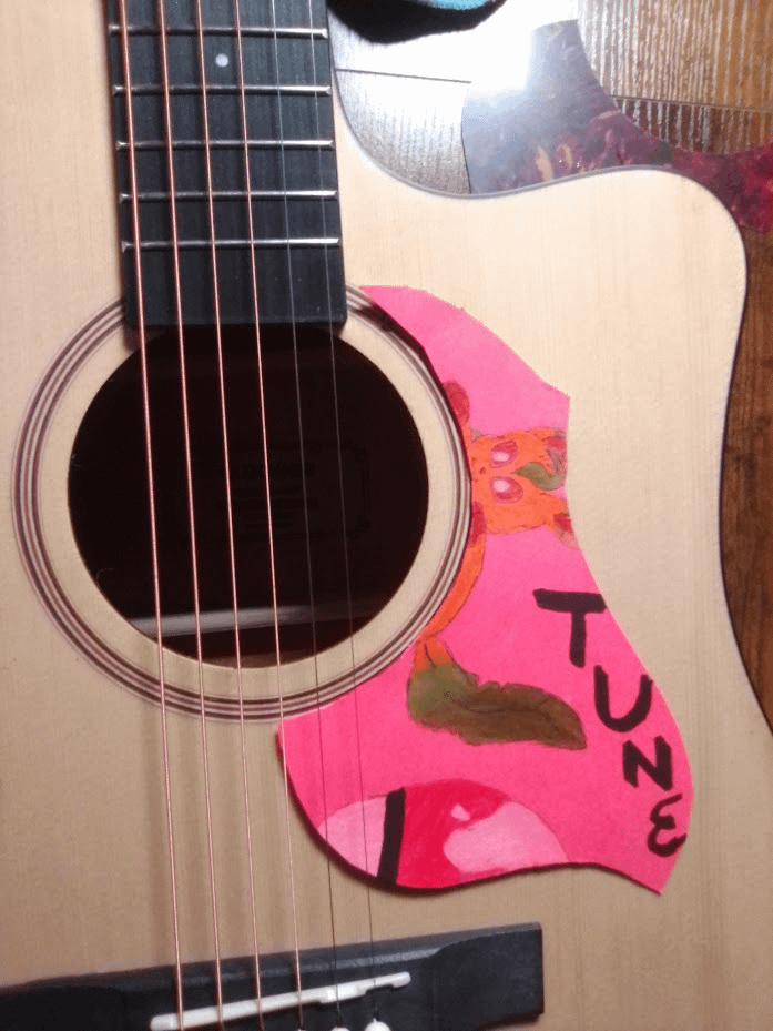 Custom guitar pick guard I made using Leafeon :)  Though it looks better in real life because of the light glare deluding it :(