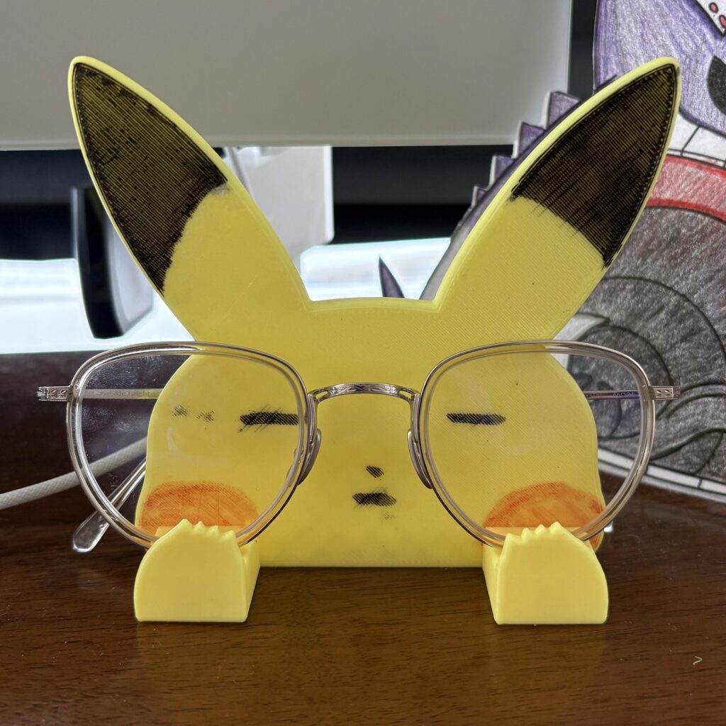 My 9yo 3d printed me a Pikachu glasses holder