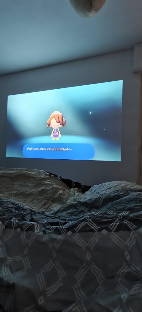 My wife, me, in bed, with newly bought Pokopia on the beamer. Can life get any better?