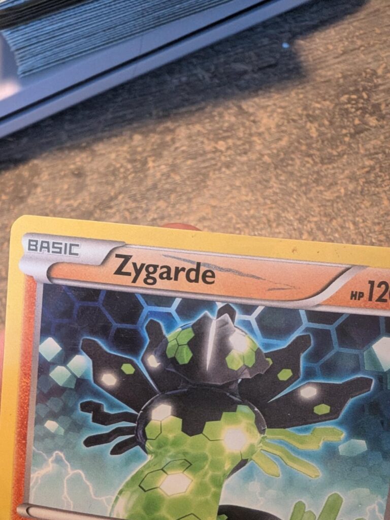 I have this zygard hollow card and it has a mark on it, but it looks like it's behind the lettering. Is this the printing error?