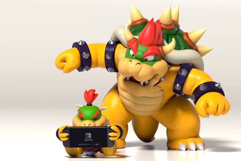 Nintendo Switch ad showing Bowser and Bowser Jr, the latter playing on a Switch while the former watches with a surprised expression on his face